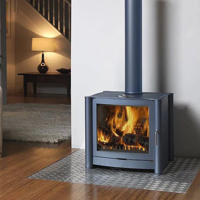 Modern wood stove with burning fire indoors.