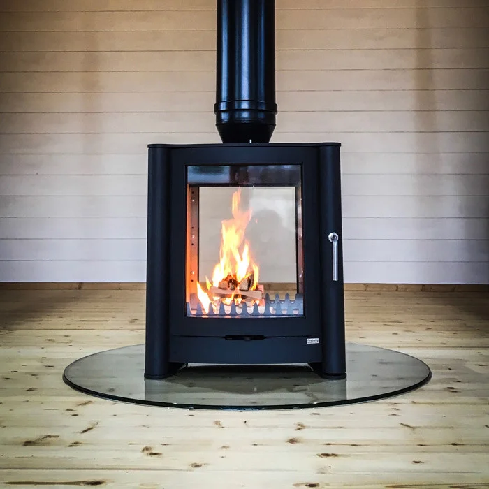 Modern wood-burning stove with glass door.